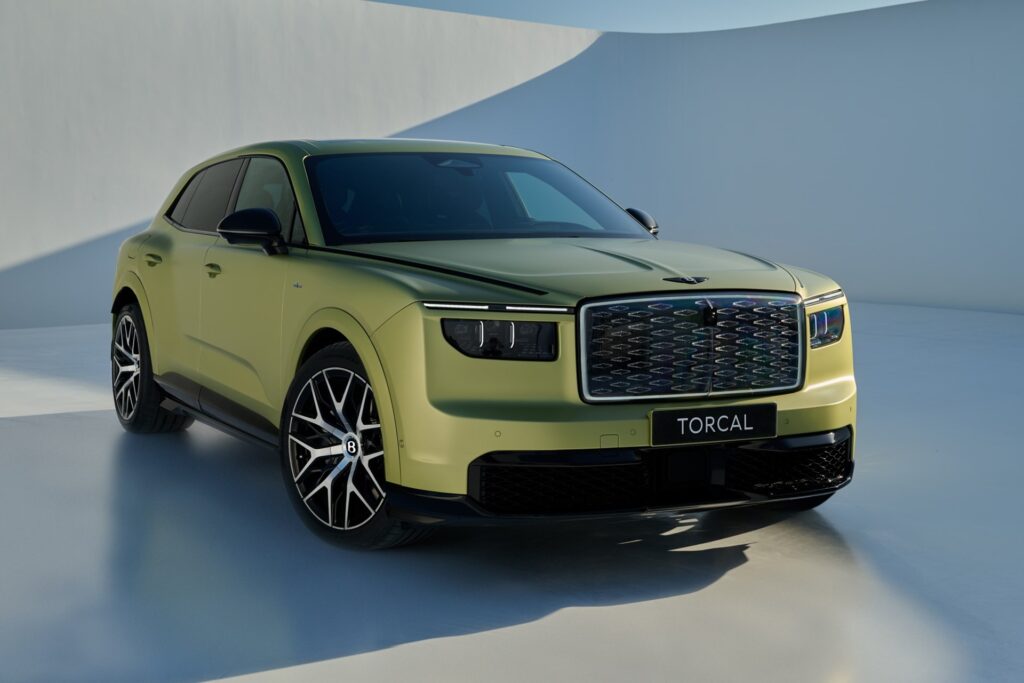 Lime green Bentley Torcal front three-quarter view in a white studio, showing its diamond-pattern grille
