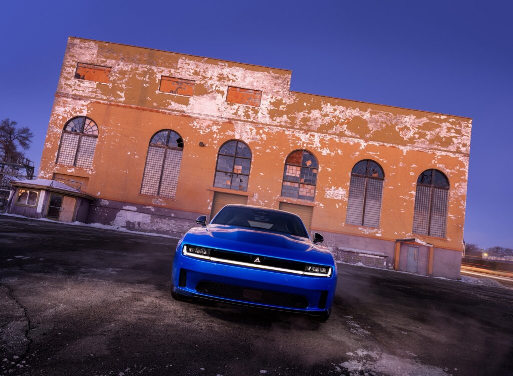 Blue 2027 Dodge Charger Daytona Scat Pack in Bludicrous paint, front three-quarter view