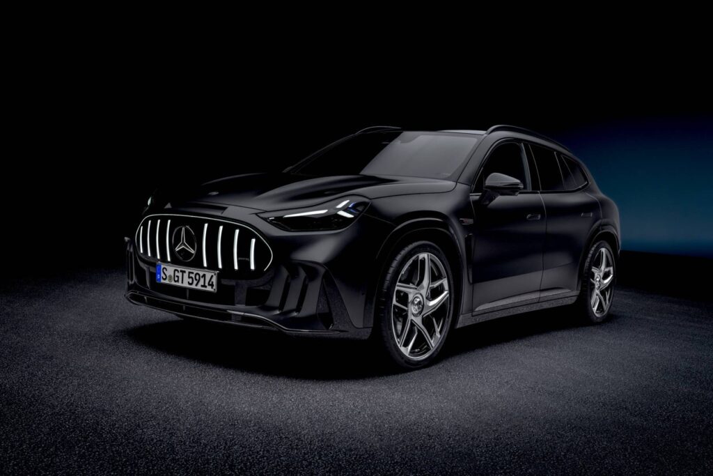 Black Mercedes-AMG GT SUV front three-quarter view in a dark studio