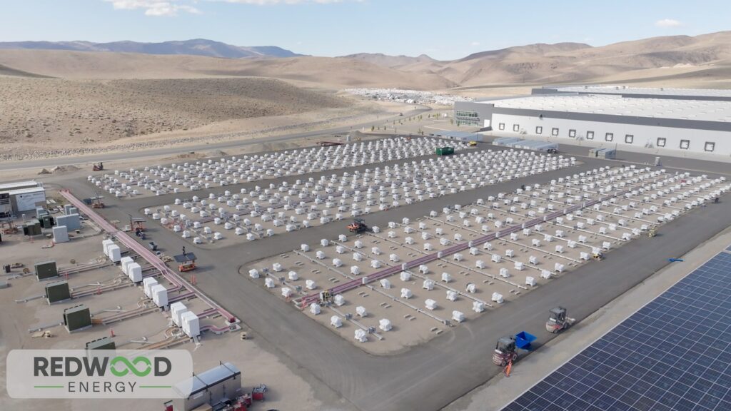 Redwood Energy storage installation built from repurposed EV battery packs beside a solar array