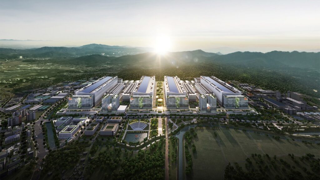 SK hynix rendering of the Yongin Semiconductor Cluster, four large fab buildings in a valley at sunrise