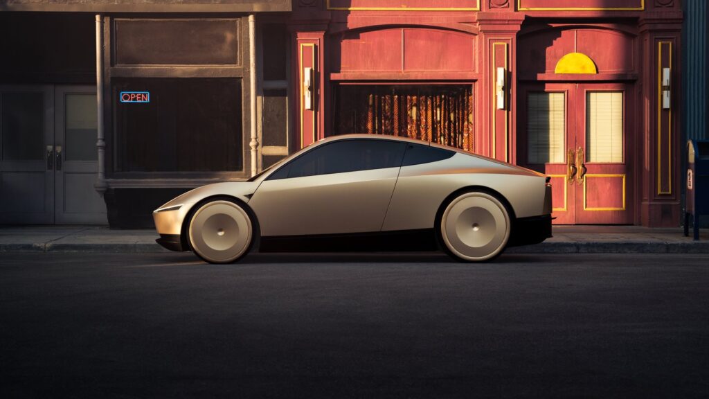 Gold Tesla Cybercab in full side profile against red storefronts at dusk