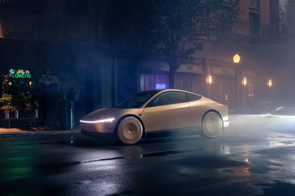 Gold Tesla Cybercab with its light bar glowing driving through mist on a dark city street