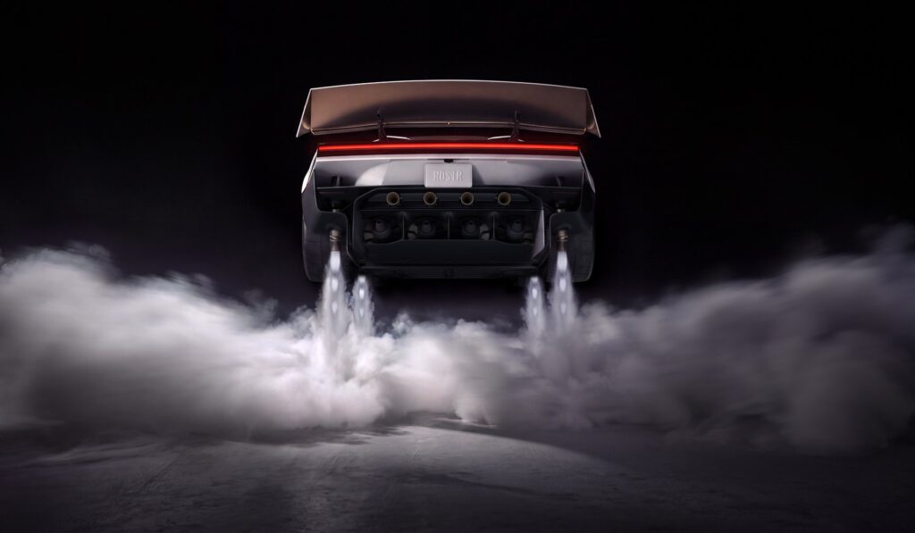Rear of the Tesla Roadster at night as its thruster nozzles blast plumes of vapor across the ground